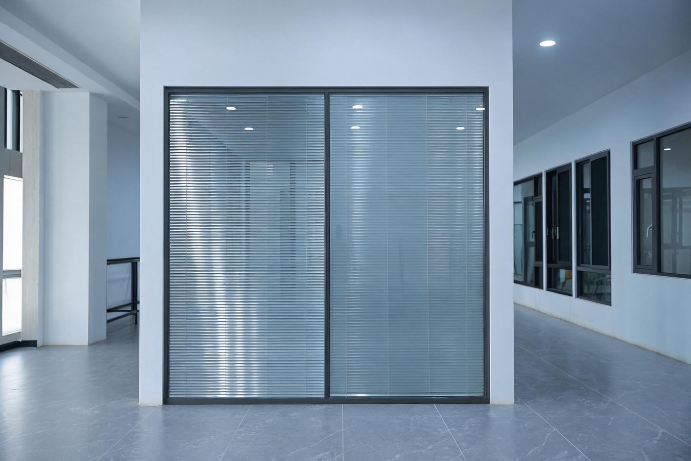 Glass office partition with slim aluminium frame